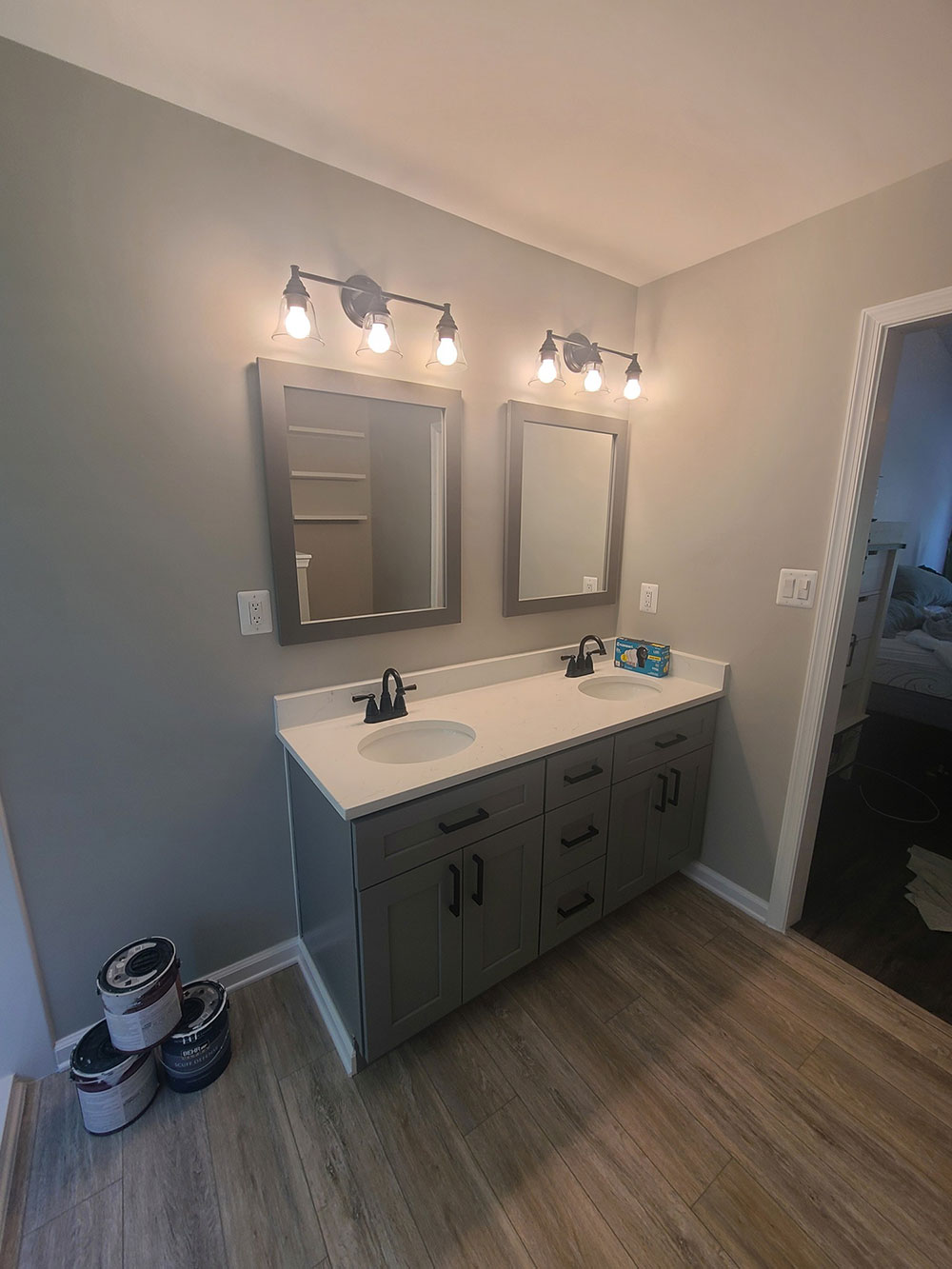 New LVT flooring, vanity, mirrors, and light fixtures